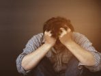 Free Photo Sad man holding head with hand