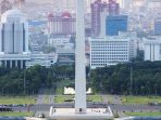 Premium Photo Jakarta city skyline with national monument monas in the afternoon
